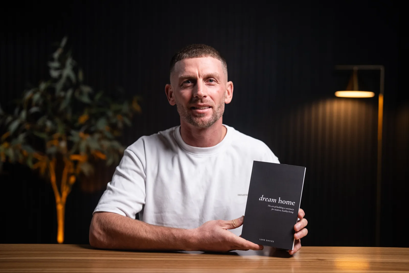 Luke Davies with the Dream Home book